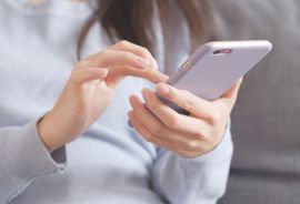 woman typing on her smartphone right to disconnect laws for global workforce