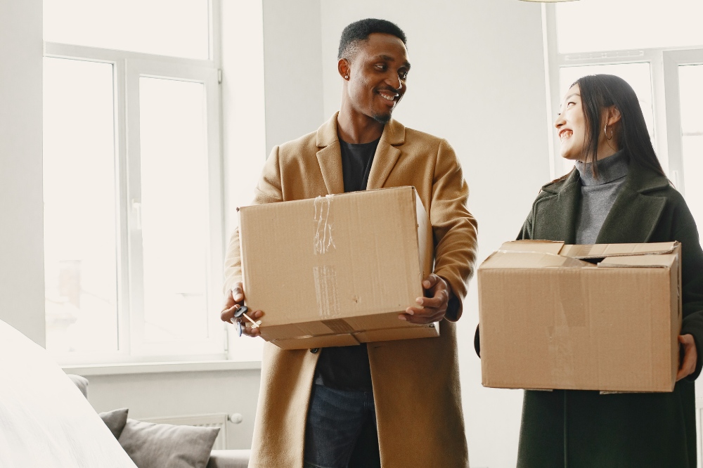 UK student packing boxes and preparing to move out of university accommodation