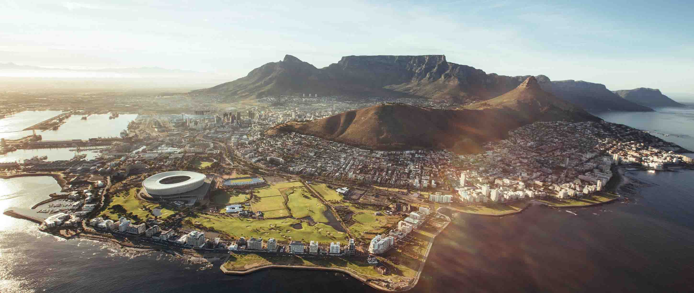 View of Cape Town city from an aerial view, with Table Mountain in the background and a clear blue sky
