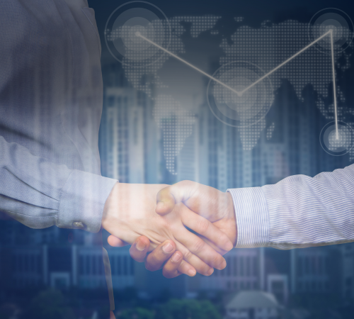 A professional handshake with a subtle world map and skyline in the background, symbolising trust and international standards.