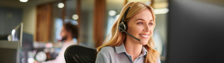 An image of an immigration specialist on the phone to an assignee, arranging their visa