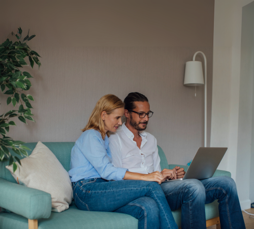 A couple reviewing their relocation destination support on the MOVEPLUS platform