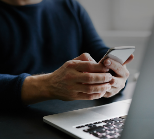 Person using MOVEPLUS technology on their phone, showcasing our digital tools to empower assignees during their relocation